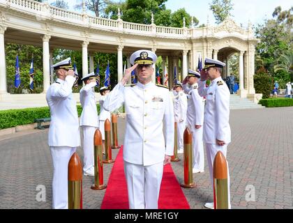 170608-N-MD713-002 SAN DIEGO (June 08, 2017) Rear Adm. Paul Pearigen, commander, Navy Medicine West, and chief of the Navy Medical Corps, renders a salute to his side boys at the arrival of the official party during a professional education graduation ceremony at the Spreckels Organ Pavilion in Balboa Park. Professional Education's mission is to equip Naval Medical Center San Diego's individuals and teams to excel in their missions by providing leaner-focused mentoring, education and training, and facilitating mission-aligned research and scholarly activity. (U.S. Navy photo by Mass Communicat Stock Photo