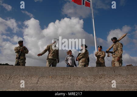 Soldiers of the 29th Infantry Division Color Guard, prepare to participate in a ceremony honoring World War II veterans held at the Omaha Beach memorial in St. Laurent-Sur-Mer,, France, June 6, 2017. The ceremony commemorates the 73rd anniversary of D-Day, the largest multi-national amphibious landing and operational military airdrop in history, and highlights the U.S.' steadfast commitment to European allies and partners. Overall, approximately 400 U.S. service members from units in Europe and the U.S. are participating in ceremonial D-Day events from May 31 to June 7, 2017. (U.S. Army Photo  Stock Photo