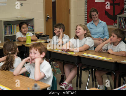 St. Patrick's School in Rockville, Maryland, is a private Catholic educational institution serving elementary grade students. The archival image documents students reacting during a June 6 career day visit by Sailors from Naval Support Activity Bethesda who discussed service in the United States Navy. Stock Photo