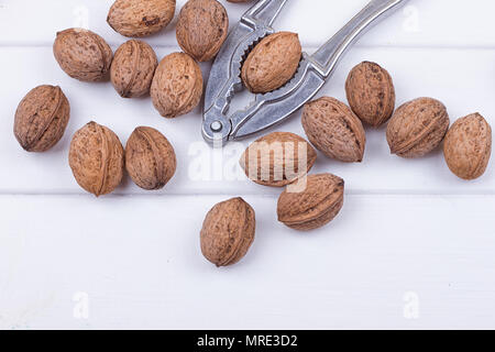 many walnuts on the white wooden background with copy-space Stock Photo