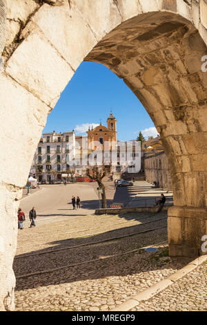 Sulmona, Italy - April 2, 2018: View from the arch of the aqueduct on the Piazza Garibaldi of Sulmona and people strolling Stock Photo