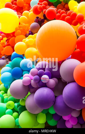 Bright abstract background of jumble of rainbow colored balloons celebrating gay pride Stock Photo