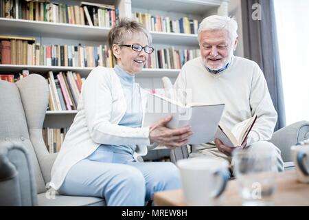 Senior couple reading books. Stock Photo