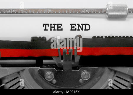 THE END text written by an old typewriter on white sheet Stock Photo