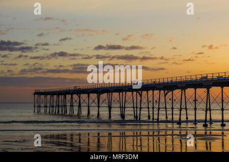 Saltburn pier at sunrise. Saltburn is a coastal town on the north east of England. Stock Photo