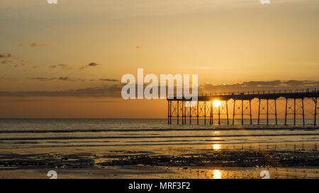 Saltburn pier at sunrise. Saltburn is a coastal town on the north east of England. Stock Photo