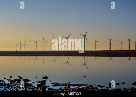 Windfarm on Redcar coastline. Sunets and low tide. Stock Photo