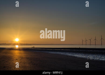 Windfarm on Redcar coastline. Sunets and low tide. Stock Photo