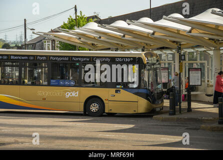 A bus waiting at the main bus station in Pontypridd town centre Stock Photo