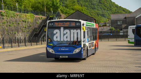 A public service bus departing the main bus station in Pontypridd town centre Stock Photo