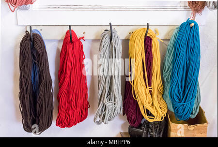 Yarn used used for weaving Southwestern Native American blankets on a loom. Town of Chimayó,  High Road between Santa Fe and Taos, New Mexico, USA. Stock Photo