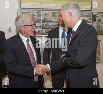 The Honorable Neil M. Gorsuch, associate justice of the Supreme Court of the United States, shakes hands with Ross Davies, professor, George Mason University, Antonin Scalia Law School, during a sunset parade reception at the Women in Military Service for America Memorial, Arlington, Va., June 6, 2017. Sunset parades are held as a means of honoring senior officials, distinguished citizens and supporters of the Marine Corps. (U.S. Marine Corps photo by Cpl. Christian Varney) Stock Photo