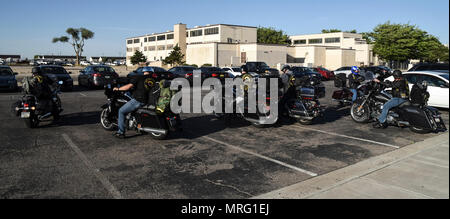 Members of the Combat Veterans Motorcycle Association park their bikes in front of the Thunderbird Inn dining facility on Kirtland Air Force Base, May 30, 2017. The veterans spoke with Team Kirtland airmen about suicide prevention and having each other’s backs in all situations. (U.S. Air Force Photo/Senior Airman Chandler Baker) Stock Photo