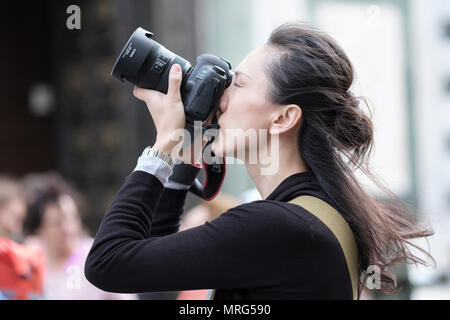 Young lady using an SLR digital camera in Florence, Tuscany, Italy, Europe, Stock Photo