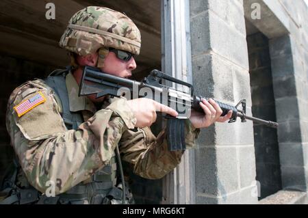 U.S. Army instructors from the basic rifle marksmanship committee guide ...
