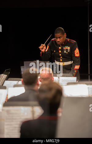 NEW YORK – Gunnery Sgt. Justin A. Hauser, enlisted conductor of Marine Corps Band New Orleans, conducts the Marine Corps Band New Orleans at Hunter College in New York, June 15, 2017. During the concert the band performed many iconic  Marine Corps songs, such as “Semper Fidelis”, “March of the Women Marines” and “The Montford Point Marines,” highlighting historical points throughout the Marine Corps Reserve timeline. (U.S. Marine Corps photo by Lance Cpl. Niles Lee/Released) Stock Photo