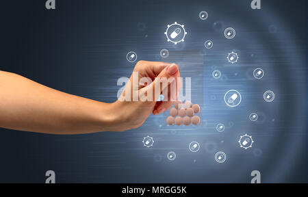 Hand delivers colorful pills in small plastic bag with medicine concept Stock Photo