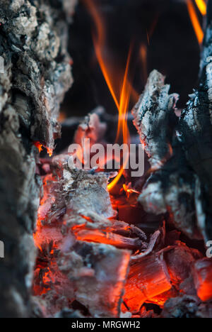 the burning charcoal brightly burns with red fire Stock Photo