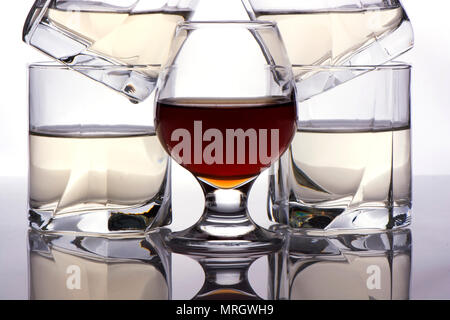 glasses stand whisky and cognac near. reflection in glass Stock Photo