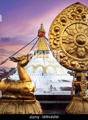 View of Bodnath Buddhist Stupa and Golden deers with leaf at the roof of monastery in Kathmandu Stock Photo