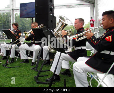 Marine Corps Band New Orleans performs at a United States Citizenship and Immigration Services naturalization ceremony at FDR Four Freedoms Park on Roosevelt Island in New York City June 16, 2017. The band’s performance was one of several performances that occurred June 14-16, in multiple locations across the city, in honor of the 100th anniversary of the Marine Corps Reserve. U.S. Marine Corps photo by Gunnery Sgt. Elizabeth Inglese Stock Photo