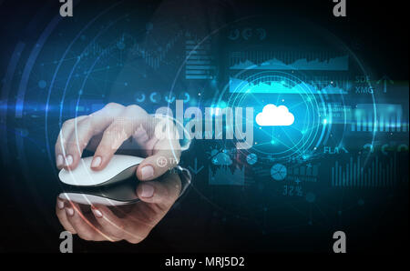 Hand using wireless mouse with cloud technology concept and dark background Stock Photo