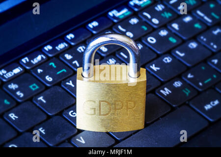 Golden padlock with GDPR engraved on computer laptop keyboard. Concept of General Data Protection Regulation (GDPR) in the European Union. Stock Photo