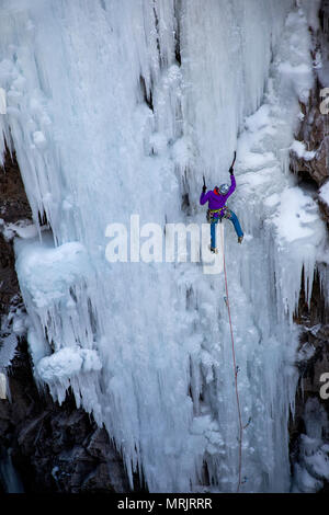 one woman lead climbs in ouray ice park Stock Photo