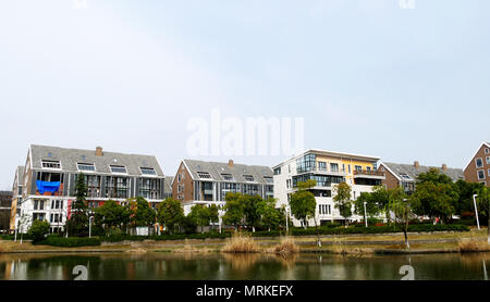 Homes beside water Stock Photo