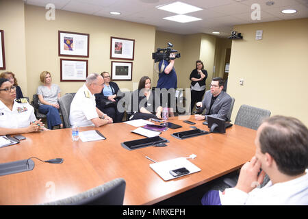 170620-N-OS584-153, Pittsburgh PA (June 20, 2018) Michael Deddel a Special operation Marines Veteran tells Vice Admiral Forrest Faison Surgeon General and Chief, Bureau of Medicine and Surgery about the treatment he received at University of Pittsburgh at Center for Military hospital the treatment the helped him at UPMC. Navy Week focus a variety of outreach assets, equipment and personal on a single city for a week-long series of engagements with key influencers and organizations representing all sectors of the market. During a Navy Week, 75-100 outreach events are coordinated with corporate, Stock Photo