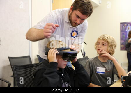 Uniformed Services University of the Health Sciences is a United States federal health sciences university that educates military medical professionals. Approximately 23 middle school-aged military children participated in a virtual and augmented reality workshop held June 3–4 at the university campus in Bethesda, Maryland. The archival image documents an educational outreach program using immersive technology. Stock Photo