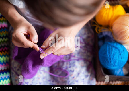 Close-up of hands knitting Stock Photo