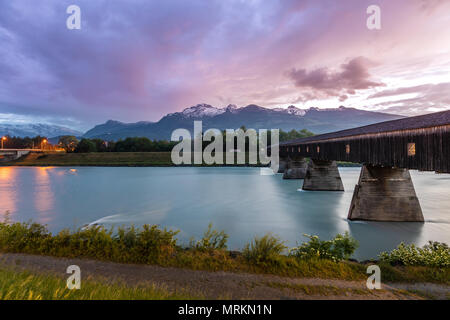 Dramatic sky in the mountains. Bridge across the Rhine. Stock Photo