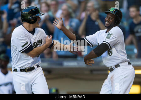 MILWAUKEE, WI - MAY 17: Milwaukee Brewers right fielder Hunter Renfroe (12)  leaps at the wall but is unable to catch a ball hit by Atlanta Braves  second baseman Ozzie Albies (1)