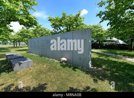 24 May 2018, Germany, Eschede: An Inter City Express (ICE) train passes the memorial for the 1998 Eschede ICE derailment, where 101 cherry trees have been planted. On 3 June 1998, the ICE 884 'Wilhelm Conrad Roentgen' derailed on the Hannover-Hamburg route near the village of Eschede. 101 people died. Photo: Holger Hollemann/dpa Stock Photo