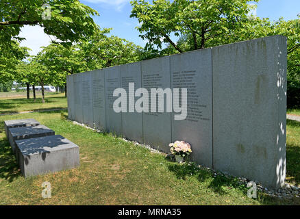 24 May 2018, Germany, Eschede: An Inter City Express (ICE) train passes the memorial site for the 1998 Eschede ICE derailment, where 101 cherry trees have been planted. On 3 June 1998, the ICE 884 'Wilhelm Conrad Roentgen' derailed on the Hannover-Hamburg route near the village of Eschede. 101 people died. Photo: Holger Hollemann/dpa Stock Photo