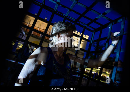 Krakow, Poland. 26th May, 2018. A woman seen inside a cage during a demonstration.Women take part in a ''˜performance' protest inside several cages in the Main Square to express their solidarity for the Women right during Mother Day in Krakow. Credit: Omar Marques/SOPA Images/ZUMA Wire/Alamy Live News Stock Photo