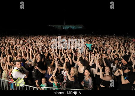 Athens, Greece. 26th May, 2018. Fans attend the concert of Locomondo, one of the most successful bands in Greece, at Stavros Niarchos Foundation Cultural Center in Athens, Greece, May 26, 2018. With a great party, featuring Locomondo, one of the most successful bands in Greece, Stavros Niarchos Foundation Cultural Center (SNFCC) welcomed the summer. More than 10,000 people showed up on Saturday evening at the Great Lawn of the park in Faliro Athens by the seaside to dance and sing with their favorite Greek band. Credit: Chris Kissadjekian/Xinhua/Alamy Live News Stock Photo