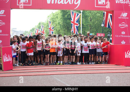 London,UK,27th May 2018,The Vitality Westminster Mile took place along The Mall in London today with Sir Mo Farah starting and running with the family race waves that included adults, kids and mascots. A record number of former British Olympians squeezed into their old kit to race the Olympians Mile. David Weir took part in the Senior Men’s Wheelchair race and finally Britain’s top male middle-distance runners, Jake Wightman, Charlie Grice and Chris O’Hare attempted  to break the historic four-minute barrier in honour of Sir Roger Bannister.Credit: Keith Larby/Alamy Live News Stock Photo