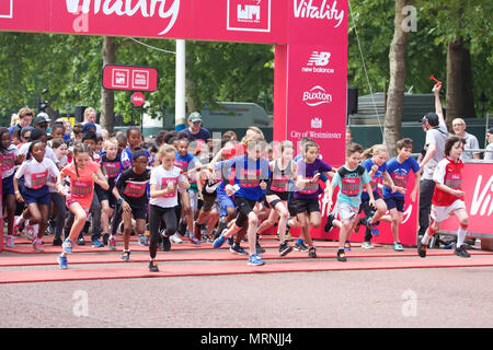 London,UK,27th May 2018,The Vitality Westminster Mile took place along The Mall in London today with Sir Mo Farah starting and running with the family race waves that included adults, kids and mascots. A record number of former British Olympians squeezed into their old kit to race the Olympians Mile. David Weir took part in the Senior Men’s Wheelchair race and finally Britain’s top male middle-distance runners, Jake Wightman, Charlie Grice and Chris O’Hare attempted  to break the historic four-minute barrier in honour of Sir Roger Bannister.Credit: Keith Larby/Alamy Live News Stock Photo