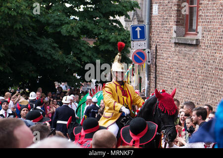 Mons, Belgium. 27th May, 2018. Participant playing role of Saint George on his way to Grand Place followed by the Dragon during Ducasse on May 27, 2018 in Mons, Belgium Credit: Skyfish/Alamy Live News Credit: Skyfish/Alamy Live News Stock Photo