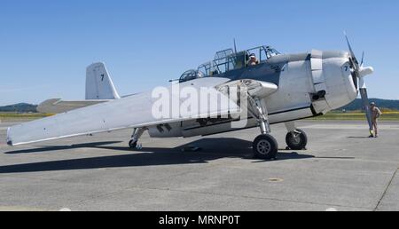 170624-N-KH214-258 OAK HARBOR, Wash. (June 24, 2017) Volunteers from the Historic Flight Foundation, based out of Paine Field international airport, demonstrate the folding wings of the Grumman TBM-3E Avenger aircraft during Naval Air Station Whidbey Island's (NASWI) open house. The open house is held in honor of NASWI's 75th anniversary and invites the public out to learn about past, current and future operations of the air station. (U.S. Navy photo by Mass Communication Specialist 2nd Class Scott Wood/Released) Stock Photo