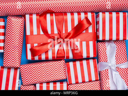 Top view of red and white gifts on the blue background Stock Photo