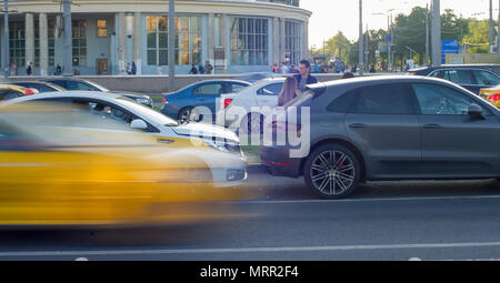 Traffic accident involving taxi and car on the road. Stock Photo