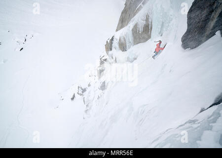 One man lead climbs multi-pitch Ice climb in Lee Vining California Stock Photo