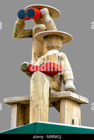Timber log sculptures on isolated gray background with clipping path. Stock Photo