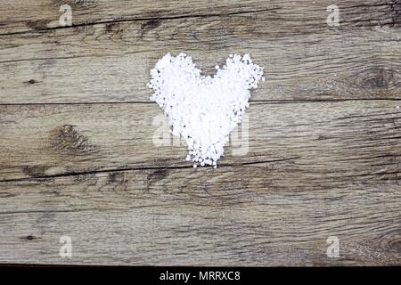 White heart made from polystyrene balls on background Stock Photo