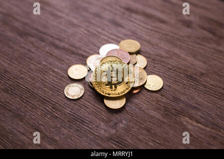 Bitcoin on coins of different countries . Digital payment system. Digital coin crypto money on bitcoin farm in digital cyberspace Stock Photo