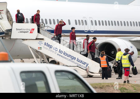 Liverpool players get off the plane at John Lennon Airport after defeat in the UEFA Champions League Final against Real Madrid in Kiev. Stock Photo