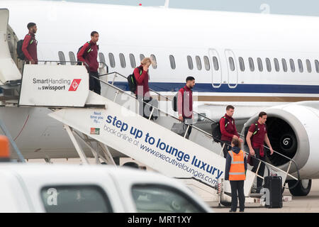 Liverpool players get off the plane at John Lennon Airport after defeat in the UEFA Champions League Final against Real Madrid in Kiev. Stock Photo